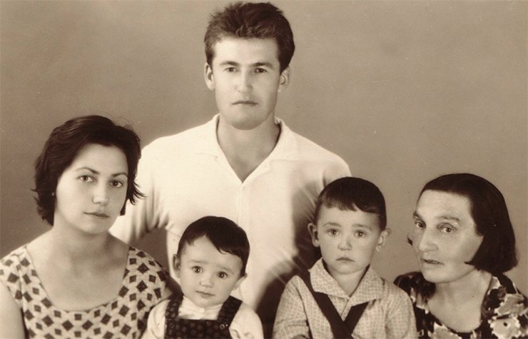 Six-month-old Andrei with his parents, brother and grandmother