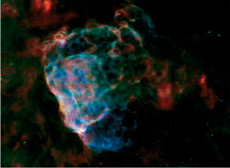This image shows the destructive force of a powerful supernova explosion. The bubbling cloud is an irregularly shaped shock wave generated by a supernova whose explosion could have been observed from the Earth 3700 years ago. The remnants of this star (the object Puppis A) are about 7000 light years away from us and almost 10 light years in size. The photo is assembled from images in the infrared (red and blue represent wavelengths of 70 µm and 24 µm, respectively) and X-ray (blue) ranges. Credit: NASA/ESA/JPL-Caltech/GSFC/IAFE