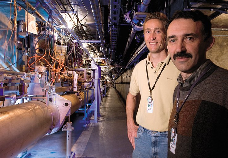 Andrei Seryi with a colleague in the accelerator tunnel at SLAC