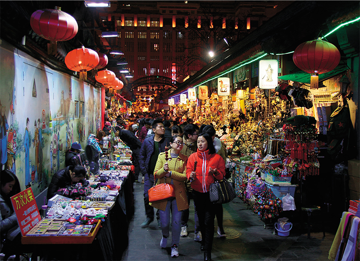 Evening market in Wangfujing, one of the most famous shopping streets in Beijing, where you can buy food and souvenirs or have a snack