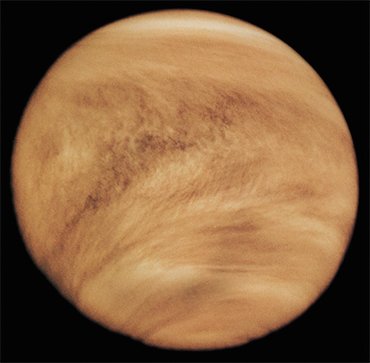 Clouds in the atmosphere of Venus are composed of tiny droplets of highly concentrated sulfuric acid. The V-shape of the clouds is due to the strong winds blowing near the equator. Because of the dense cloud layer, the Venusian surface can be observed only in radio and microwave bands and in some regions of the near infrared. This image of the Venusian surface was made by Pioneer Venus 1 in the ultraviolet rays in 1979. Credit: NASA