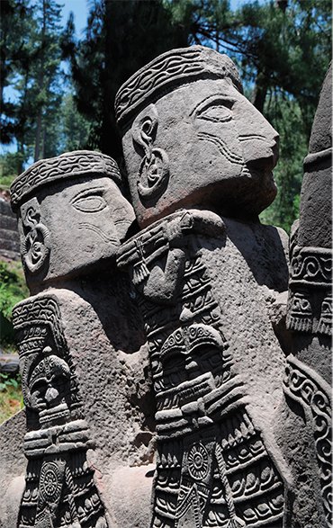 The tabular napes of all men statues must reflect a typical anthropological feature of the population – the so-called ring, or fronto-occipital deformation. The horse harness features carefully sculpted, good-sized round cheek-pieces with bridle and reins strapped to them and is adorned with round brasses depicting a polypetalous flower (supposedly, the lotus)