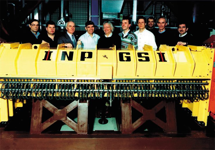 1996. Electron cooler in the SIS-18 synchrotron with the ring radius of 216 m at the Institute for Heavy Ion Research (Germany). This accelerator can accelerate ions up to a velocity of 90 % of the velocity of light. The photograph shows the team of Russian and German physicists participating in the development and fabrication of the cooler