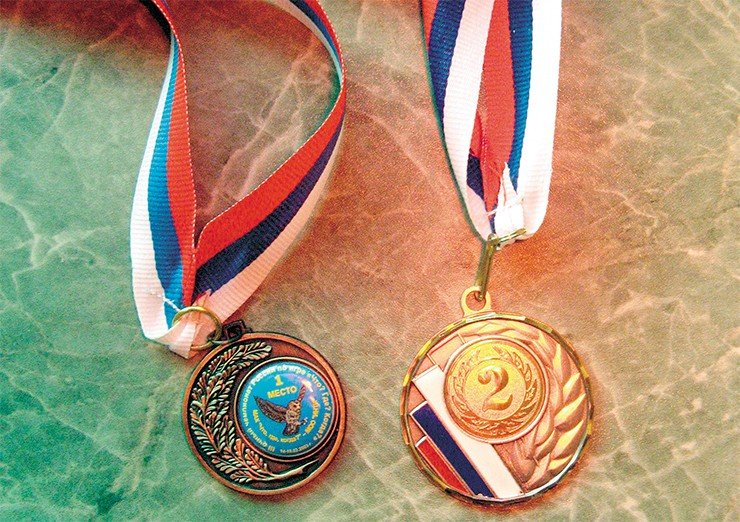 Медали, полученные автором с чемпионатов России по ЧГК 2003 г. и 2009 г. 
