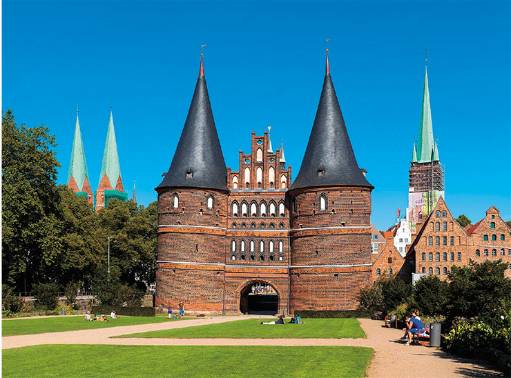 Lübeck preserved numerous monuments of its great Hanseatic past. One of the most famous sites is the city’s Holsten Gate with its Latin inscription: Concordia Domi Foris Pax (‘Harmony within, peace outside’) (below). © CC BY-SA 3.0/ Christian Wolf