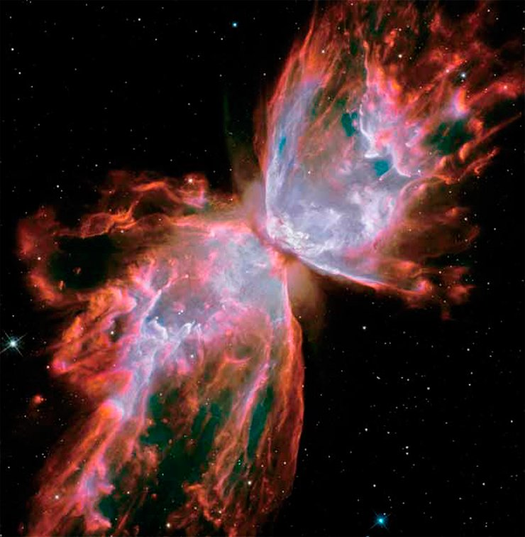 The “wingspan” of the Butterfly Nebula (NGC 6302 in the new catalog) in the constellation Scorpius is more than three light years; the nebula itself is about 4000 light years away from the Earth. Its dying central star is now very hot (its surface temperature is estimated at 250 000 °С), shining brightly in the ultraviolet. However, the star is hidden from us by a dust ring dissecting a bright band of ionized gas. Image from the Hubble Space Telescope, 2009 Credit: NASA / ESA / Hubble