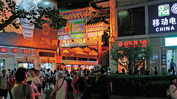 There are always plenty of people at the entrance to the night market in Wangfujing