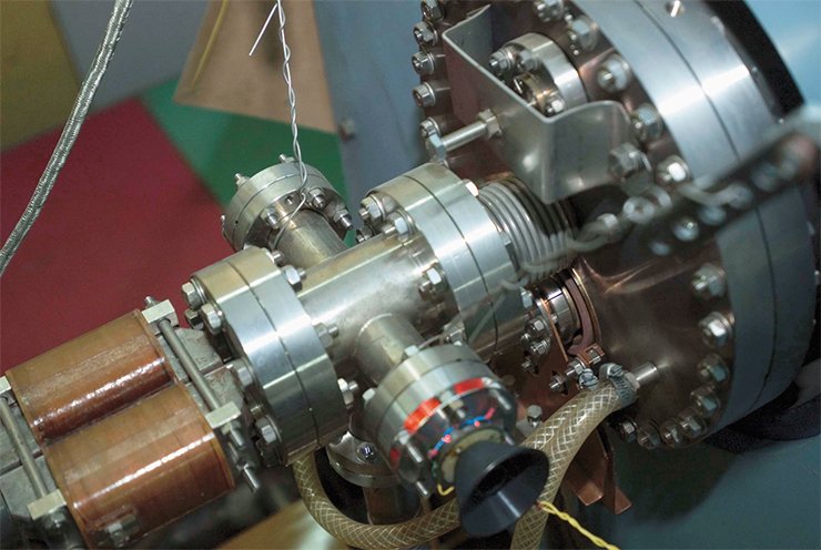 Conversion system unit — a positron source. Today, the VEPP-5 complex consists of two linear accelerators and a cooler storage ring. After rotation by 180° in the magnetic field, electrons from the first accelerator reach the conversion target and produce positrons, some of which are then accelerated to 510 MeV in the second accelerator. Ahead of the positron target there are two pulsed magnets, which deflect electrons by a small angle in opposite directions. This allows a parallel transfer of the electron beam and causes some electron bunches to pass by the target into the second accelerator, which in this case is adjusted to accelerate electron bunches from 300 MeV to 510 MeV. Then, each of the accelerated electron or positron bunches is let into the cyclic cooler storage ring