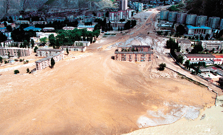 Mud flows, torrents composed of mud and stones in a mountain river bed, are dangerous both because of their destructive power and suddenness. In the photo: the mudslide sloughed off onto Tyrnyauz (Kabardino-Balkaria) in 2000