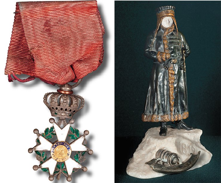 Left: the badge of the order of the Legion of Honour, the French national order instituted by Napoleon Bonaparte on 19 May 1802 by the example of the knight’s orders. Presented by D. G. Burylin at the exhibition “1812” in Moscow at the Emperor’s Russian Historical Museum. France. 1810. Silver, enamel. Length 40 mm. Right: Napoleon. Presented by D. G. Burylin at the exhibition of 1812 in Moscow at the Emperor’s Russian Historical Museum. An unknown author. Russia (?). The end of 19th — beginning of the 20th. c. Bronze, ebony, stone
