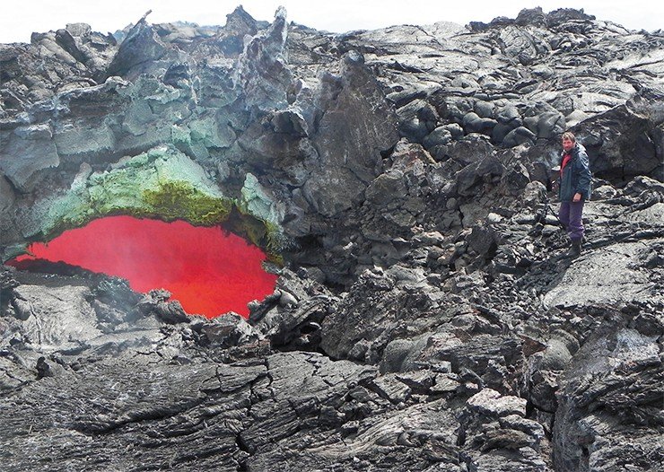 A breakdown in the roof of a lava duct with flowing lava. May 2013. Photo by M. Belousova