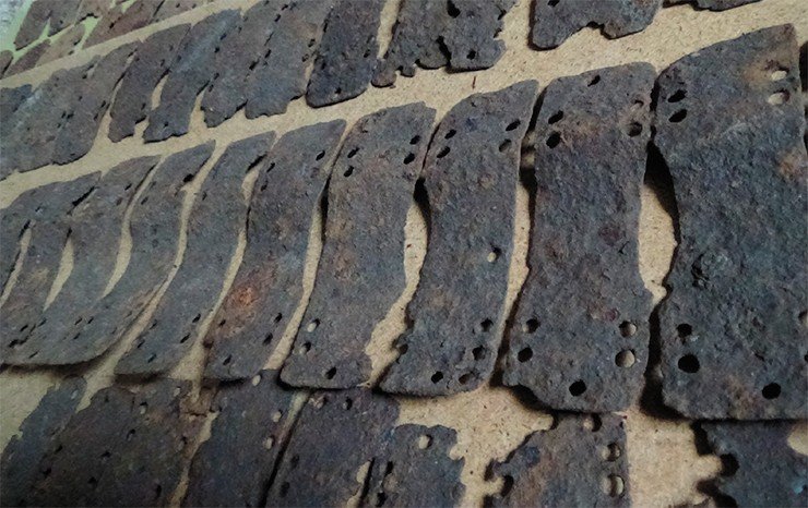 Typical iron plates of the Avar lamellar cuirass, which served as a prototype for the armor reconstruction. An accidental find in the Samara region (Russia). NSU Museum. Photo by the author
