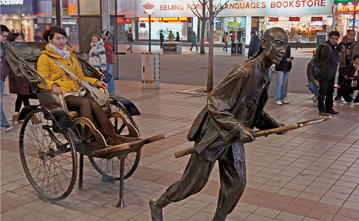 Street sculpture of a running rickshaw, an eternal symbol of Old China
