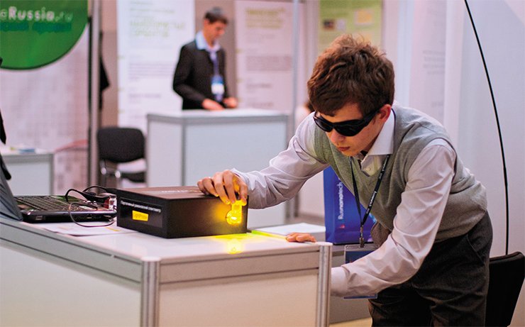 Using the new optical analyzer, one can determine the chemical composition of the substance rapidly and accurately, even through bag walls. In the photograph, D. A. Gavrilov, one of the analyzer developers, is demonstrating its capabilities at the RusNanoTekh-2010 exhibition (Moscow)