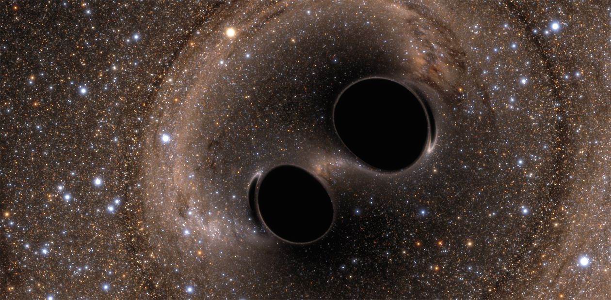 Две черные дыры сливаются в единое целое. Image Credit: the Simulating eXtreme Spacetimes (SXS) project 