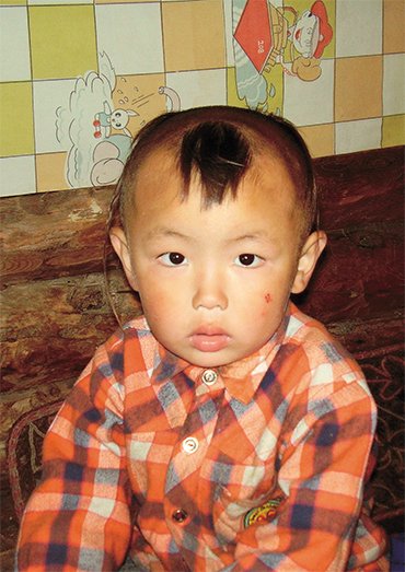 When a child is three, the parents do his hair in a certain style (tulum), leaving hair on the forehead and temples. Children wear this hairdo until the first haircut ritual